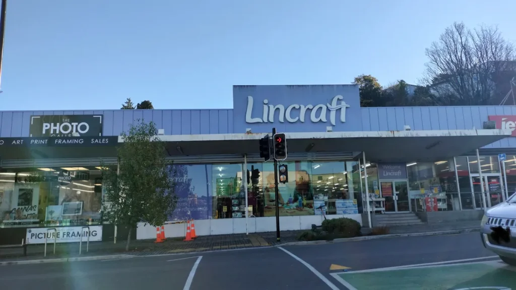 Lincraft's Dunedin store and New Zealand head office on Filleul Street, seen from the street, with the raised Lincraft sign above the shopfront windows and entrance; photographed on 22 June 2026.